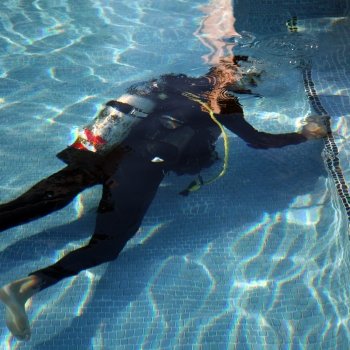 american leak detection of louisville technician checking for a leak in a residential pool